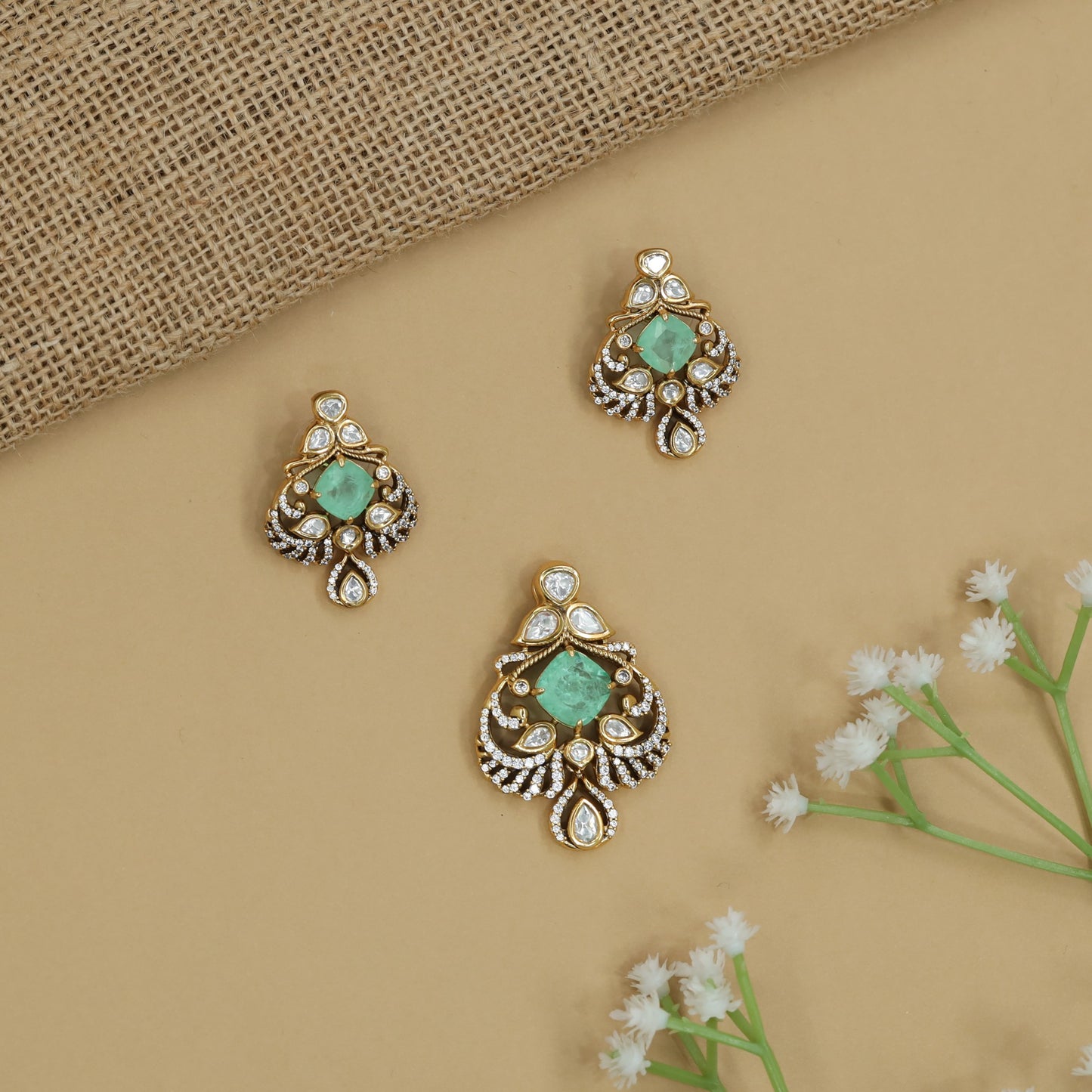 Ornate Floral Pendant Set with Curved Border Arrangement and Matching Earrings