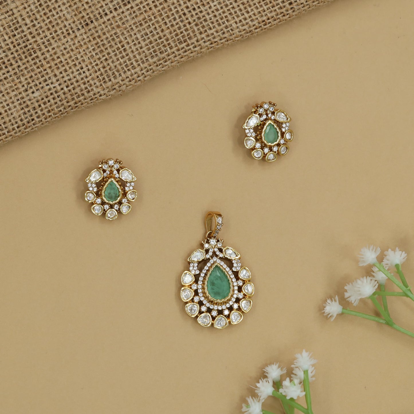 Regal Pear Kundan Pendant Set with Floral Border Arrangement and Matching Earrings