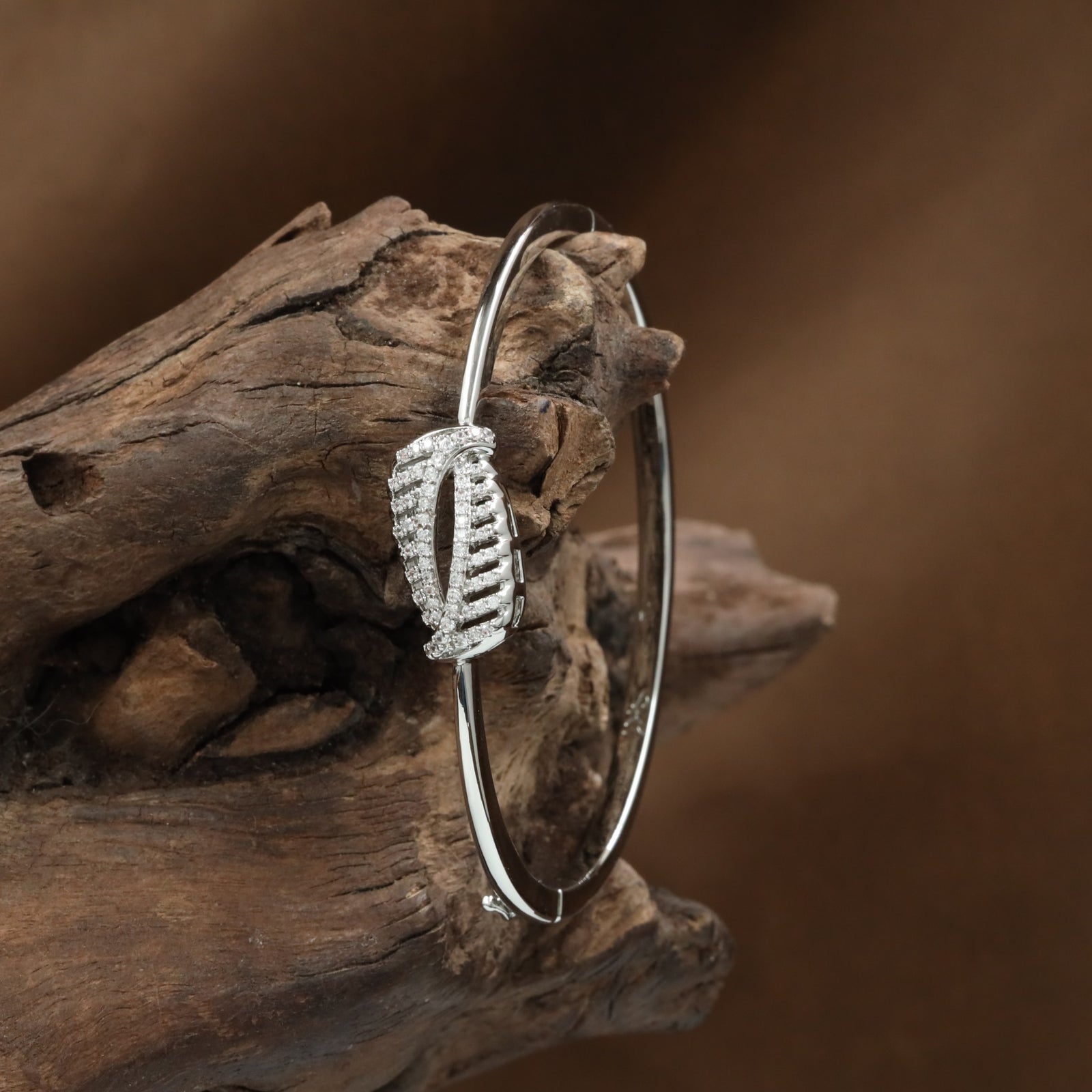 Bezel Feather Kada with Structured Leaf Placement and Curved Styling