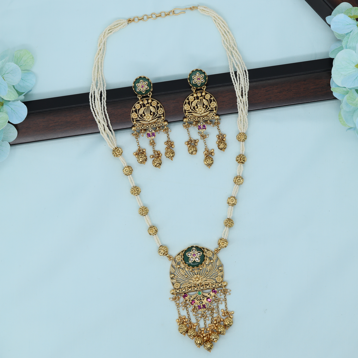 Sophisticated Beaded Long Haara with Engraved Pendant and Hanging Drops