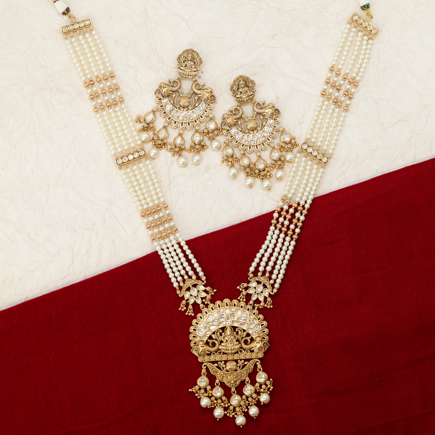 Anandini Pearl Quad Strand Long Haara with Lakshmi Arch Pendant and Pearl Drops