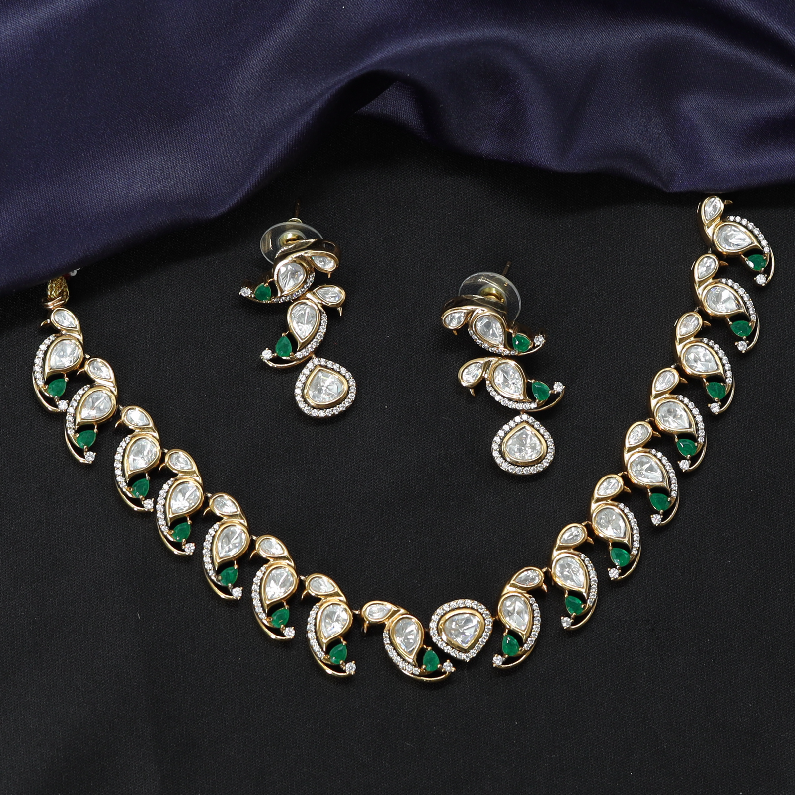 Structured Design Necklace with Repeating Curved Elements and Earrings