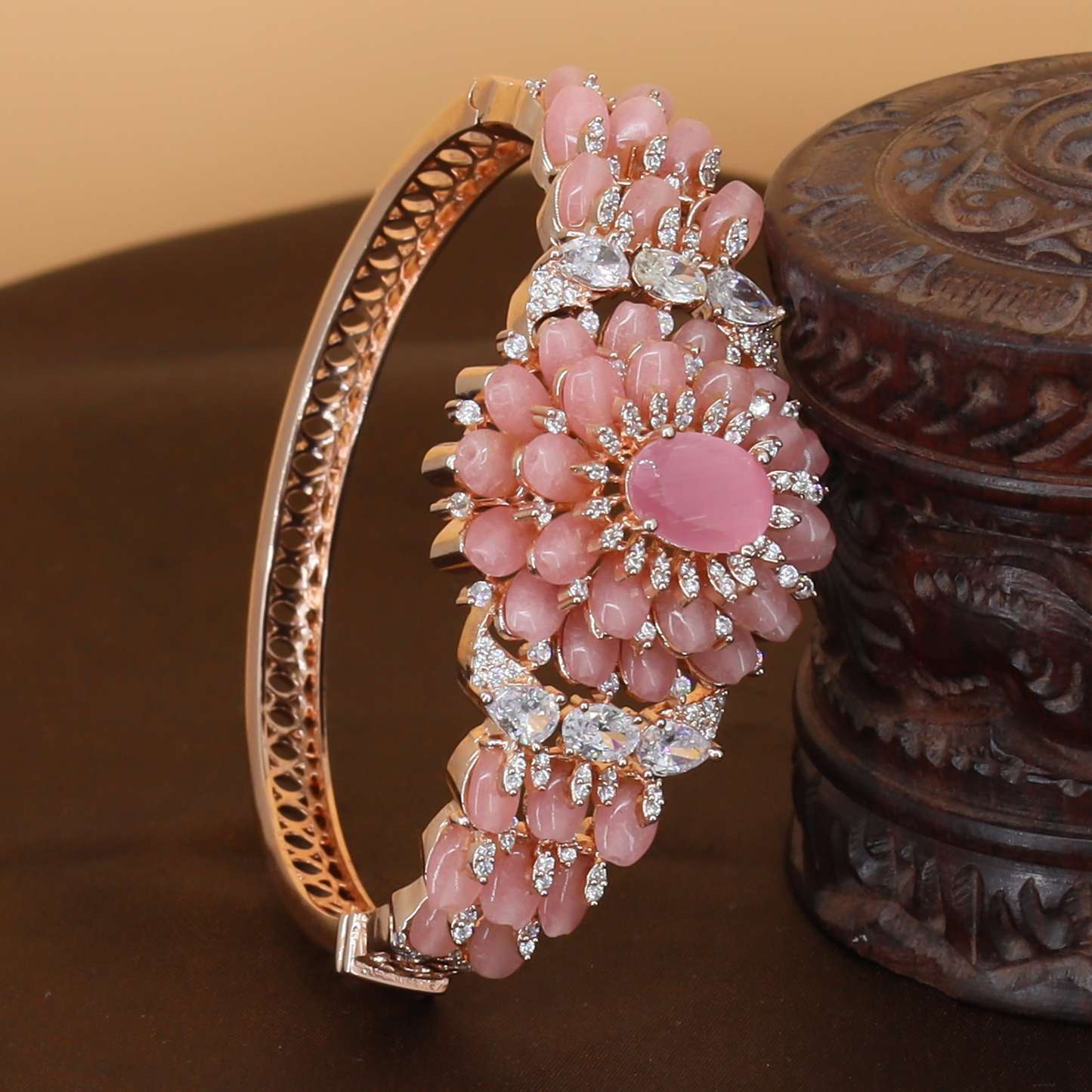 Curving Floral Cluster Bangle with Petal Arrangement and Statement Center