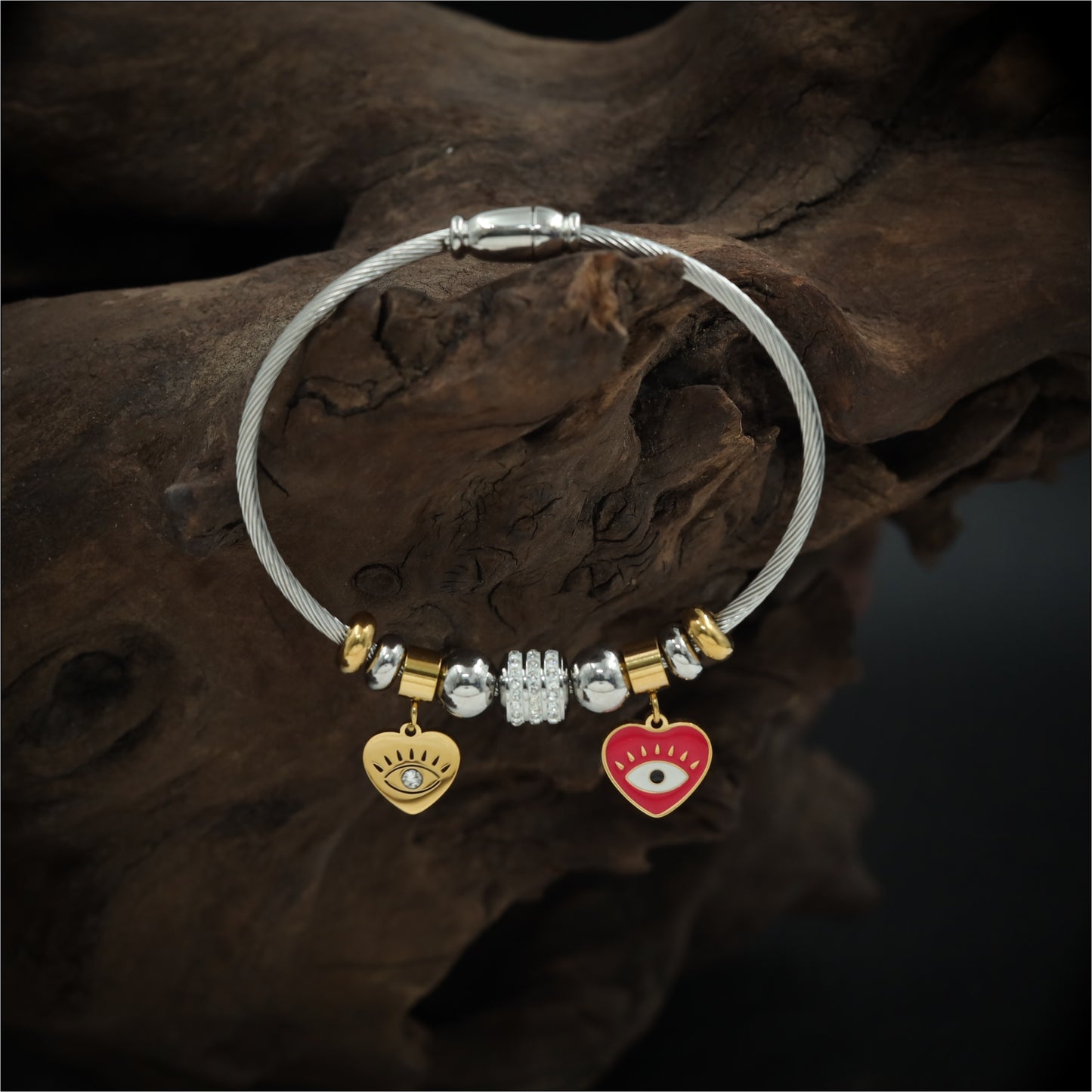 Playful Charm Bracelet with Cable Wire Band and Hanging Heart Eye Pendants