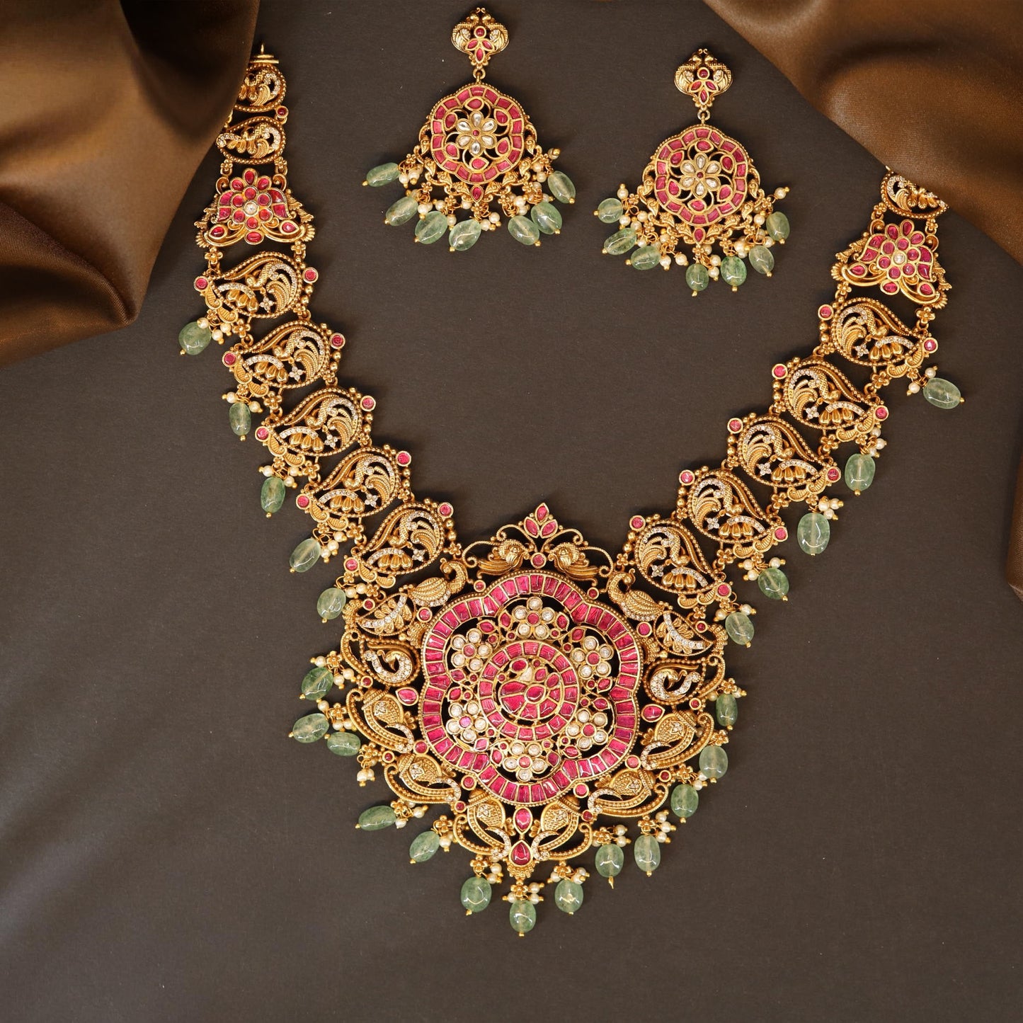 Radiant Floral Medallion Necklace with Intricate Filigree Panels and Drop Accents