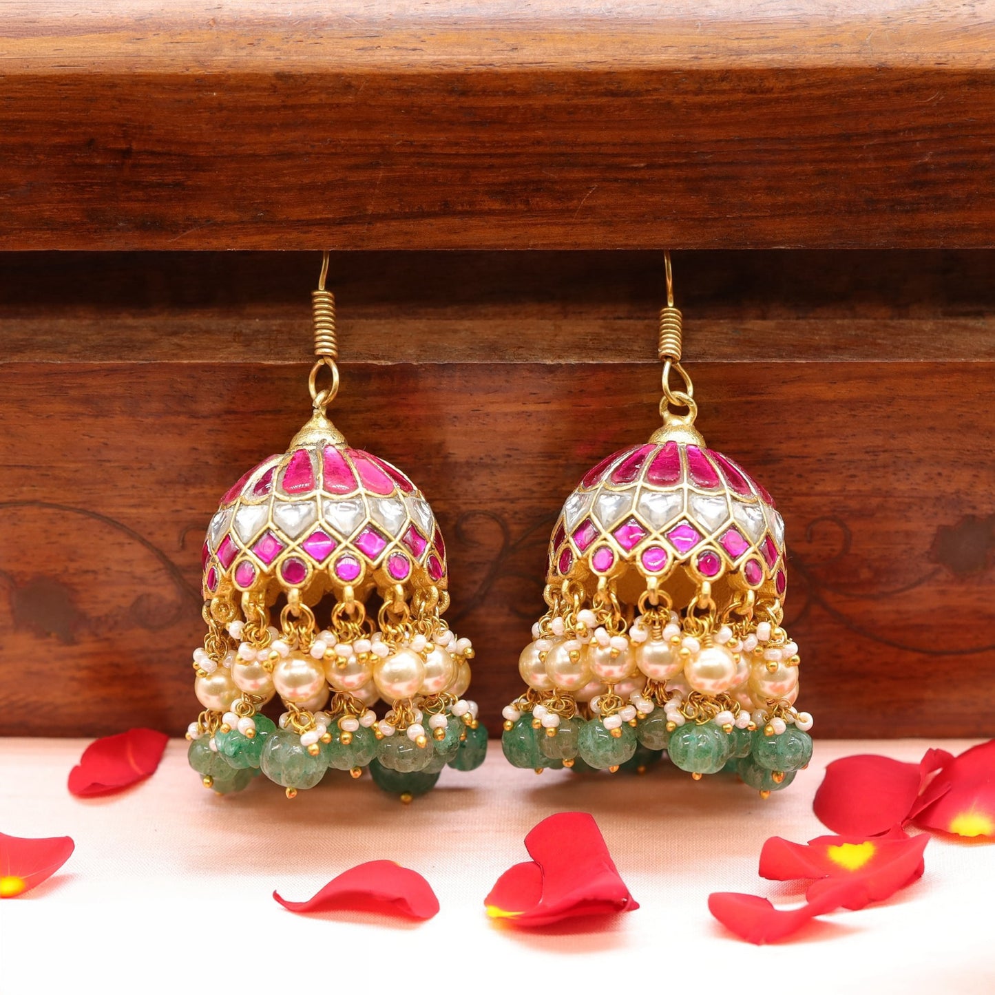 Rounded dome jhumka with structured surface and cascading drop layers