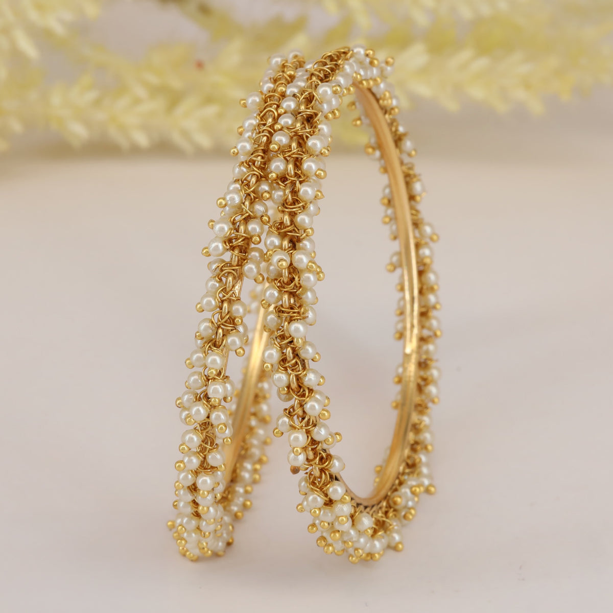 Antique pearl bangles with intricate floral detailing