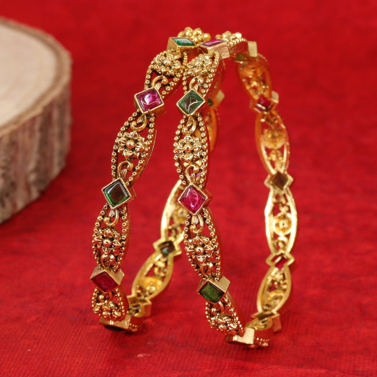 Antique bangles with intricate floral detailing and square accents