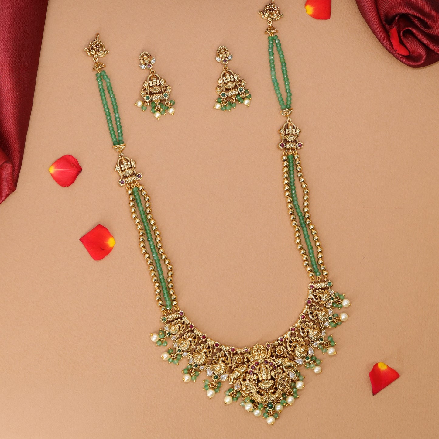 Sculpted Lakshmi haara with elongated bead strands and decorative link panels