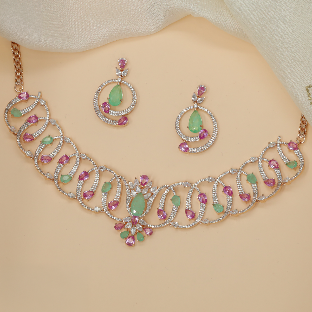 Rose gold crystal necklace with an artistic sequence of interlocking loops