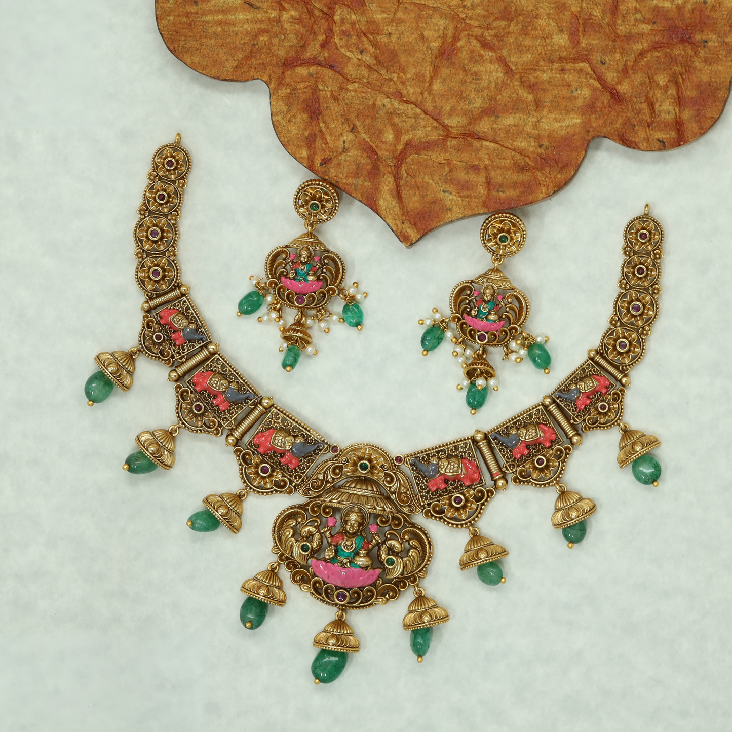 Antique Lakshmi Necklace with Sculpted Goddess Panels and Ornamental Bell Drops