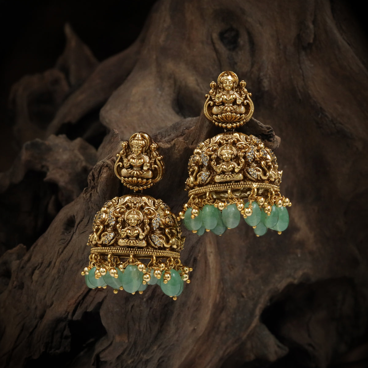 Antique Jumka Featuring Lakshmi Figures Framed by Intricate Scrollwork