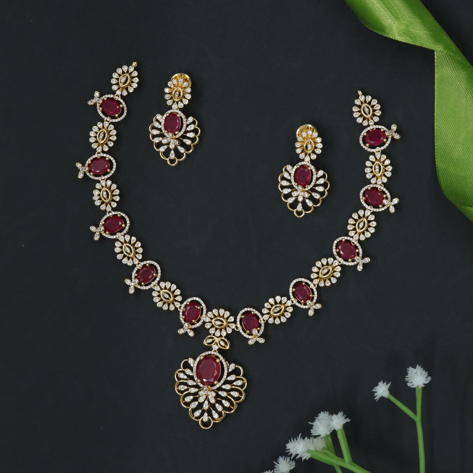 Intricately Designed Necklace with Floral Links and Oval Stone Accents