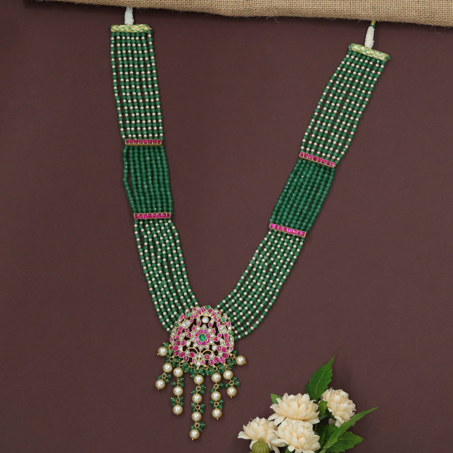 Jadau Long Haara Featuring Parallel Bead Strands and Luxury Floral Pendant Drop