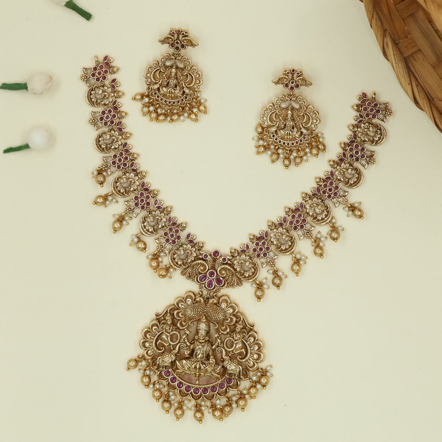 Elaborate Lakshmi Pendant Necklace with Ornamental Elephant Relief and Pearl Tassels