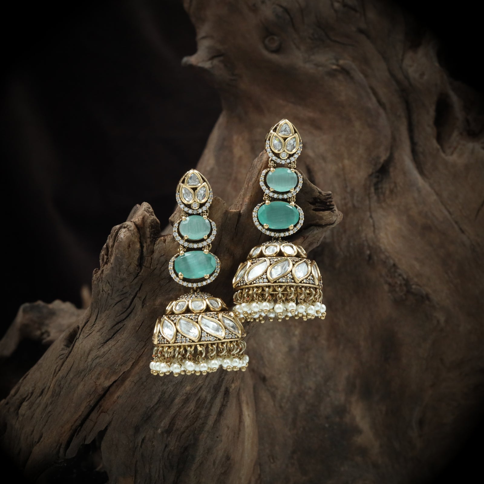 Triple oval cascade jumka with carved stone dome and bead border