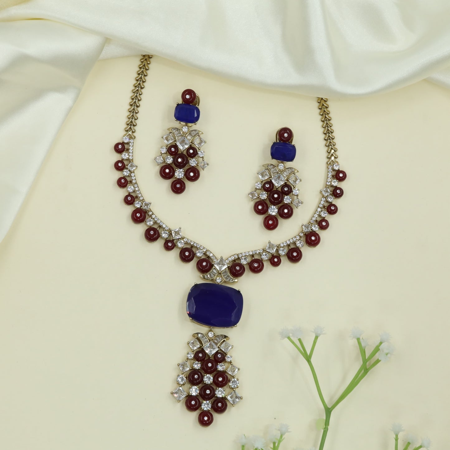 Refined Arc Design Necklace with Repeating Round Drops and Structured Centerpiece