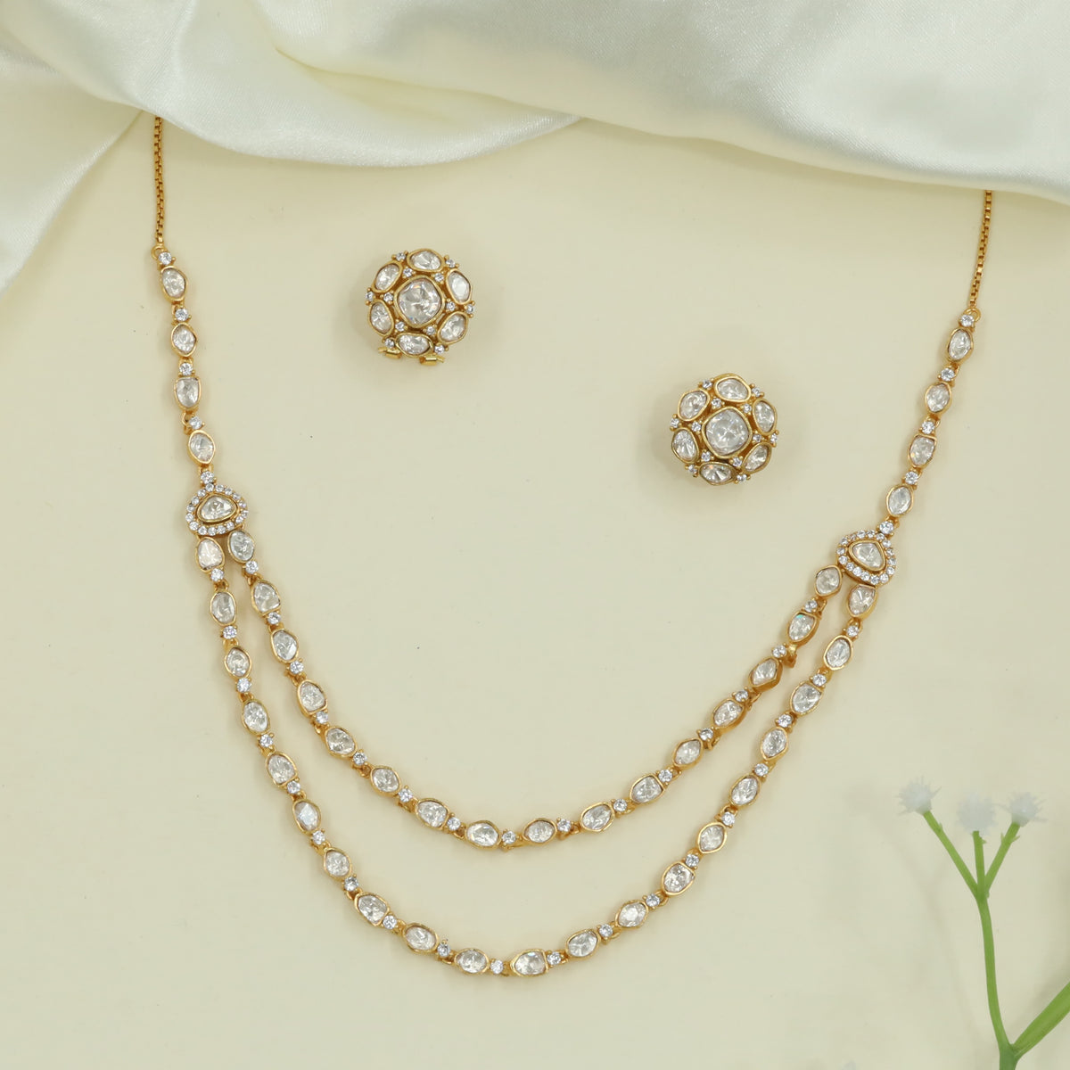 Flowing Dual Chain Necklace with Linked Cushion Units and Side Teardrop Features