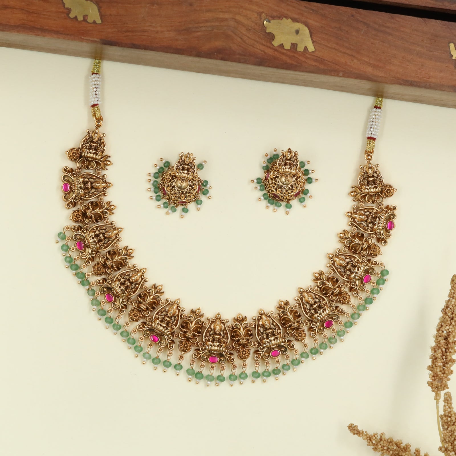 Grand Lakshmi Design Necklace with Carved Units and Drop Border Detailing