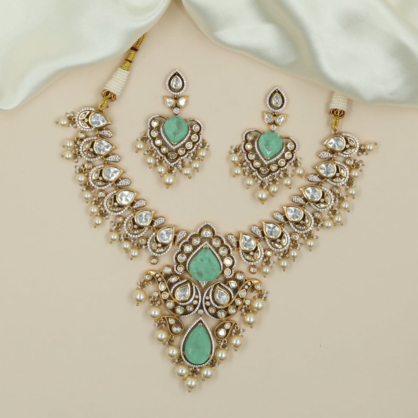 Curving Teardrop Link Kundan Necklace with Grand Central Pendant and Pearl Drops