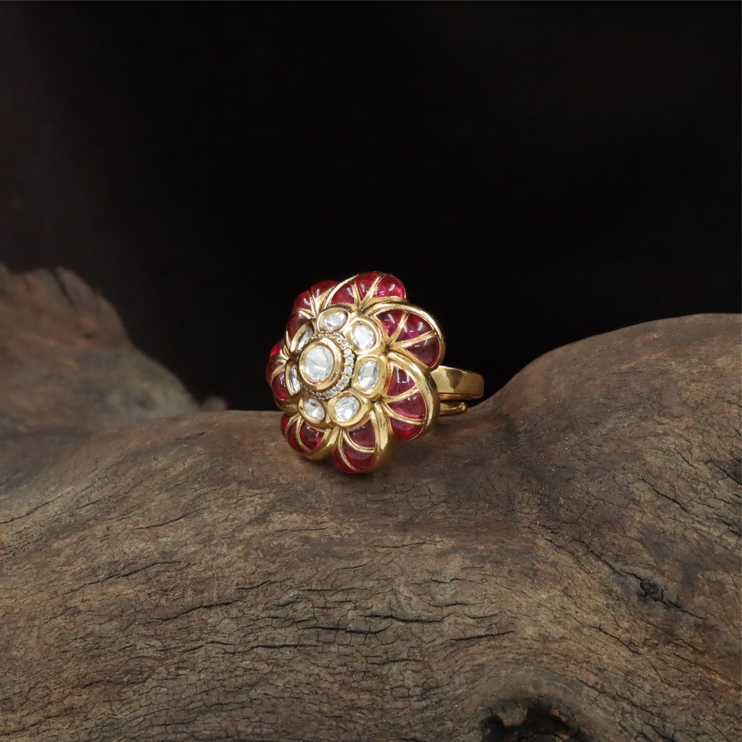 Floral centre kundan finger ring with circular core and surrounding petal segments