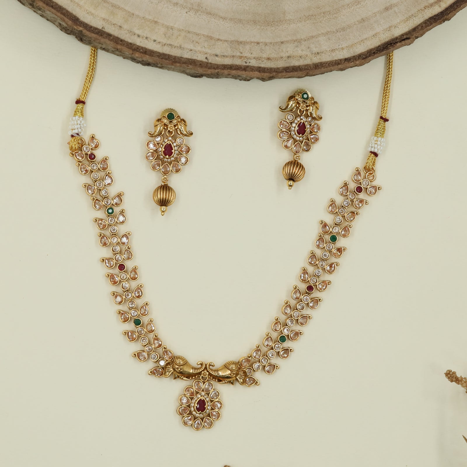 Feather pattern antique necklace with twin peacock side panels and drop centerpiece