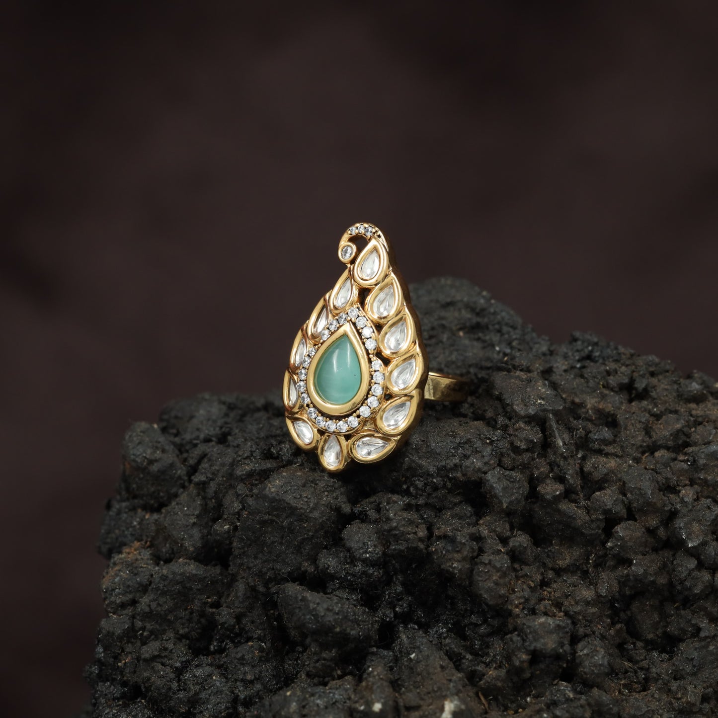 Festive Paisley Design Kundan Finger Ring With Sculpted Border Styling