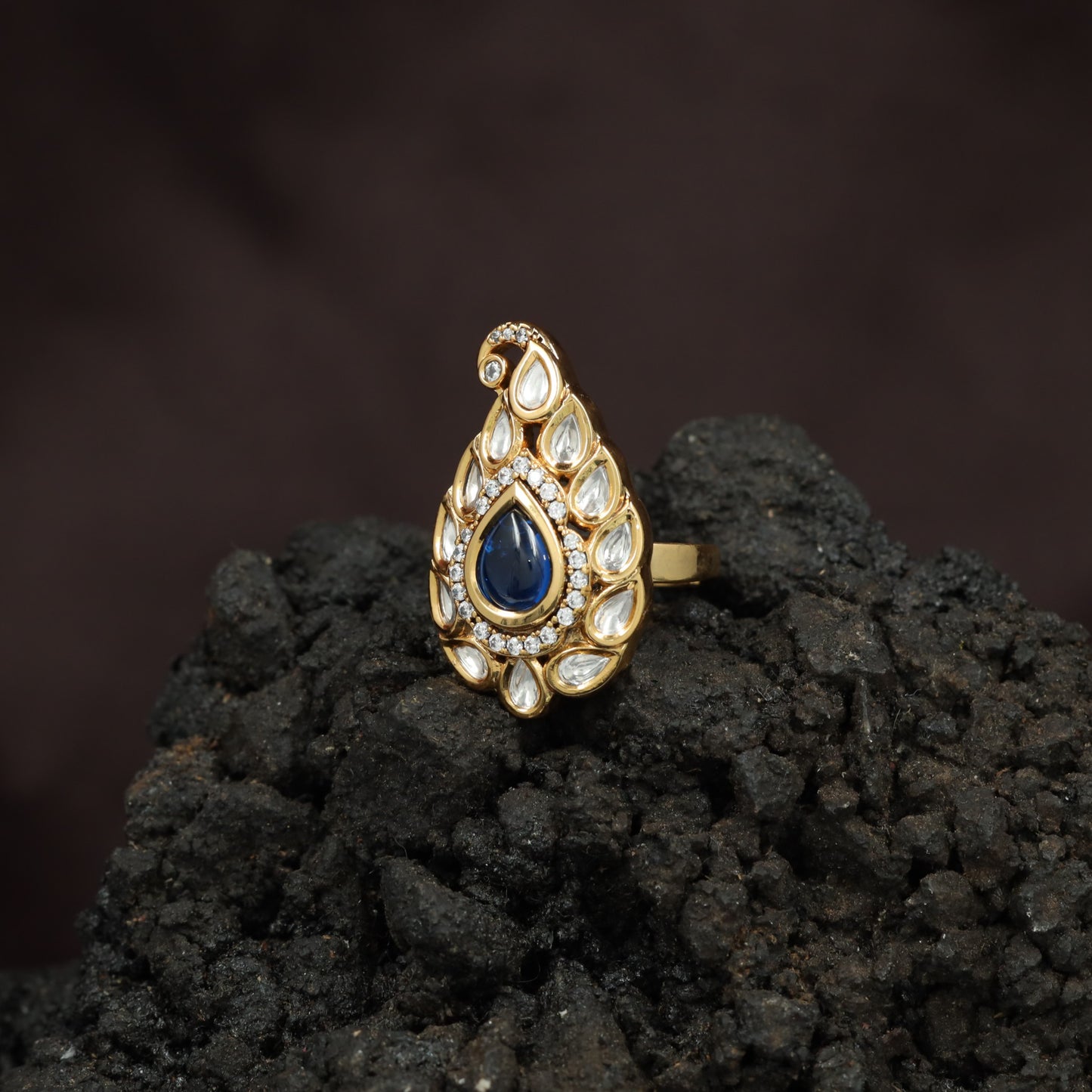 Festive Paisley Design Kundan Finger Ring With Sculpted Border Styling