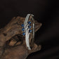 Leaf Kada with Curved Band Flow and Dangling Oval Arrangement