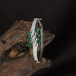 Leaf Kada with Curved Band Flow and Dangling Oval Arrangement
