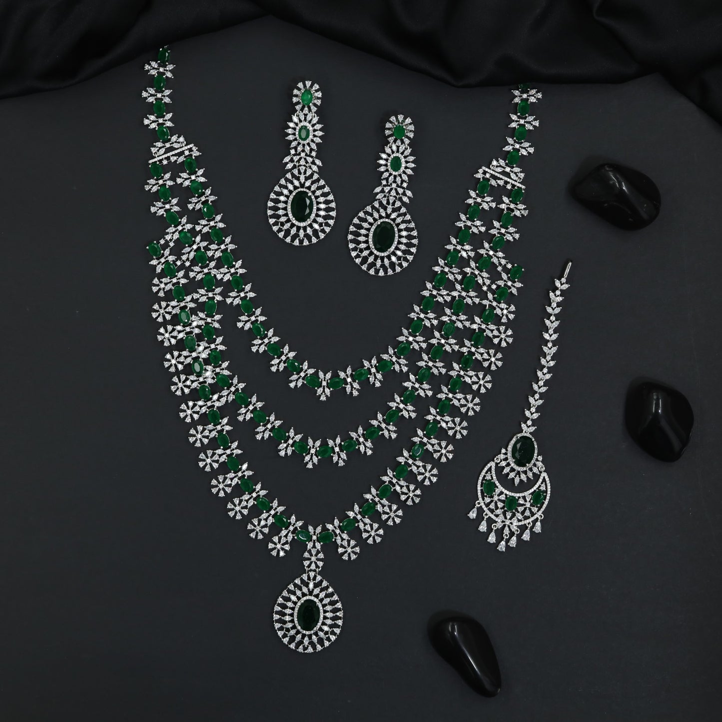 Grand long haara with floral connectors and oval pendant accents