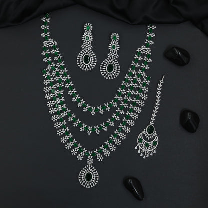 Grand long haara with floral connectors and oval pendant accents