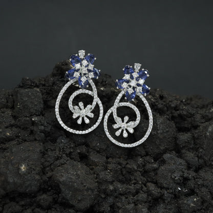 Grand Exclusive Rhodium Stud Featuring an Elongated Open Frame and Sculpted Inner Bloom