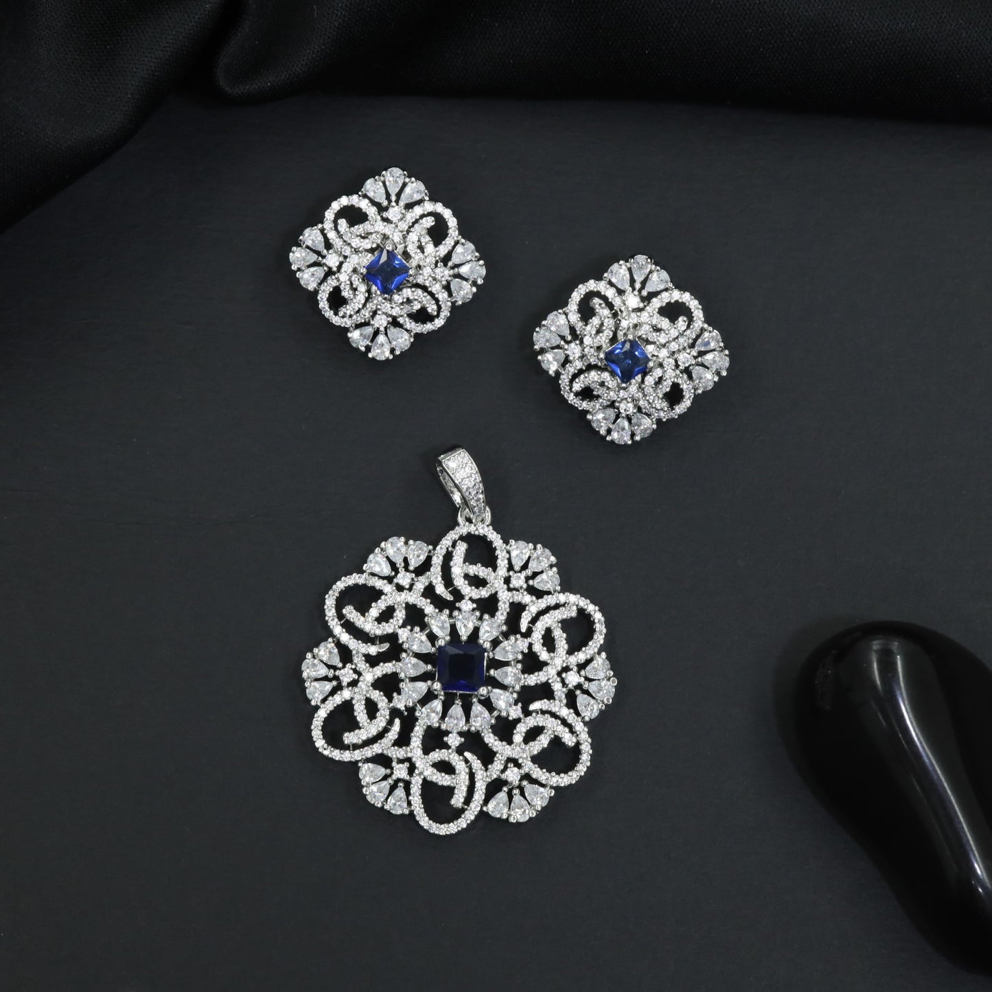 Openwork floral pendant set with scroll detailing