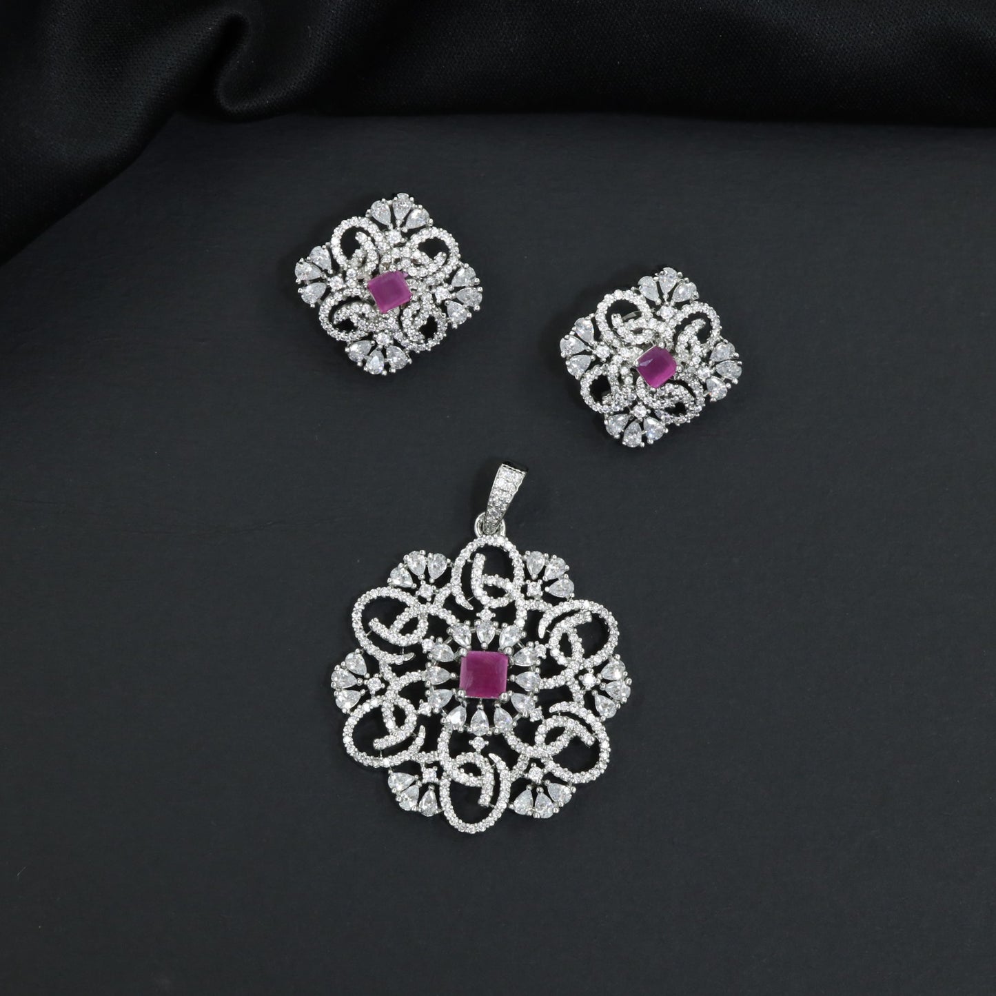 Openwork floral pendant set with scroll detailing