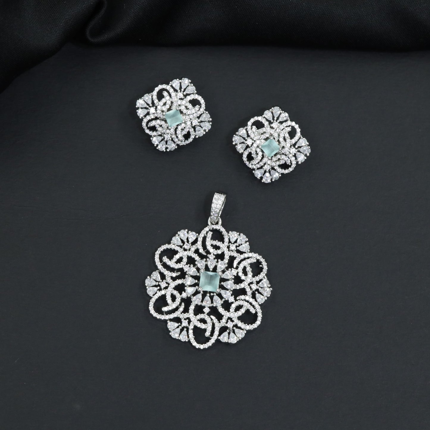 Openwork floral pendant set with scroll detailing