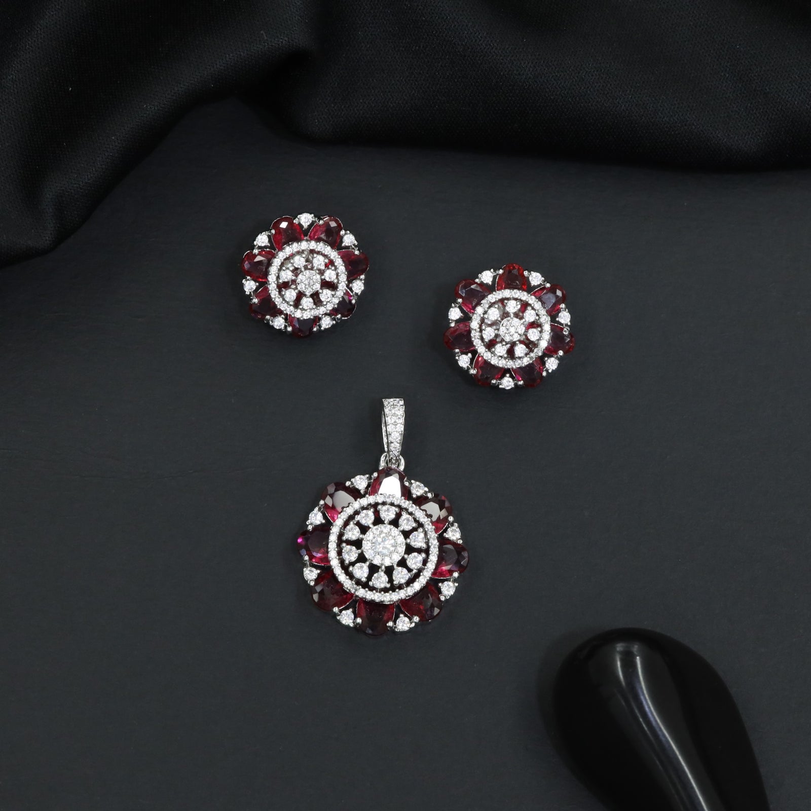 Designer pendant set featuring floral halo and circular styling