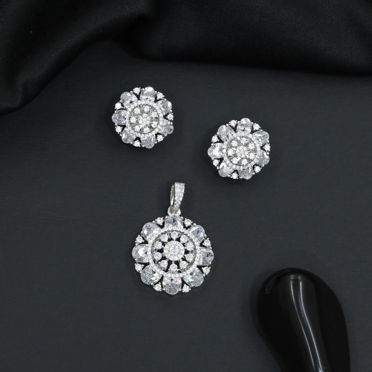 Designer pendant set featuring floral halo and circular styling