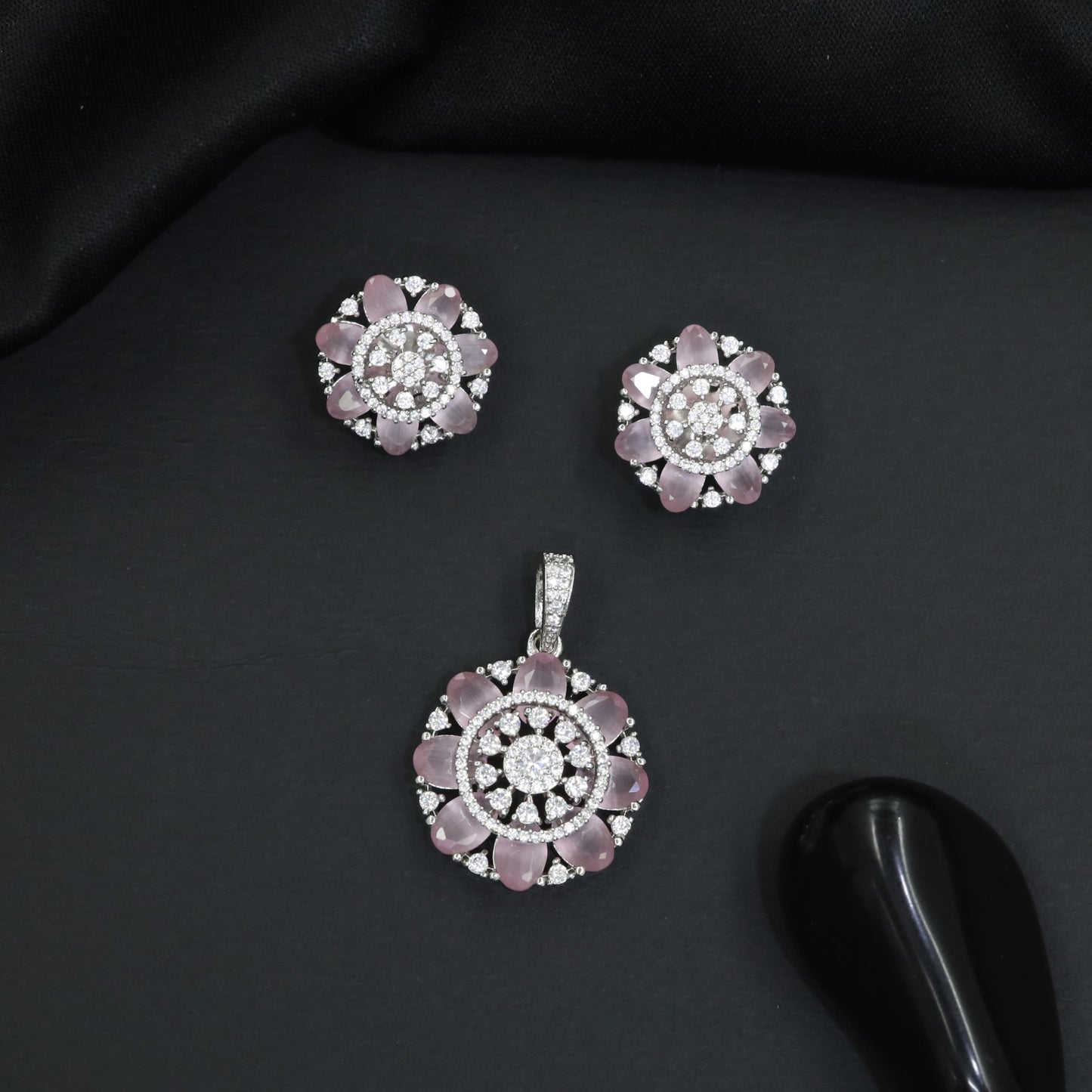 Designer pendant set featuring floral halo and circular styling