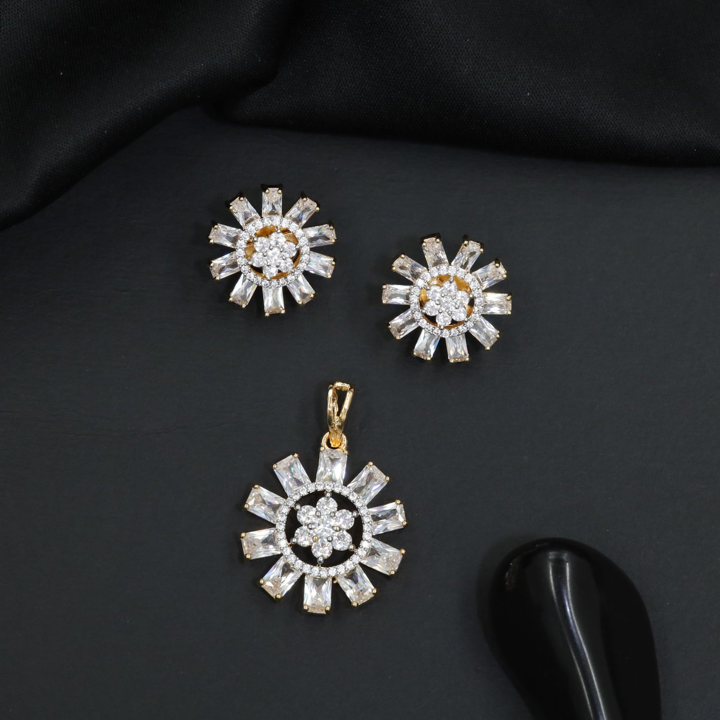 Round floral pendant set with structured sunray detailing