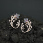 Decorative Floral Stud Earrings with Flowing Scroll Motif