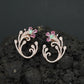Decorative Floral Stud Earrings with Flowing Scroll Motif
