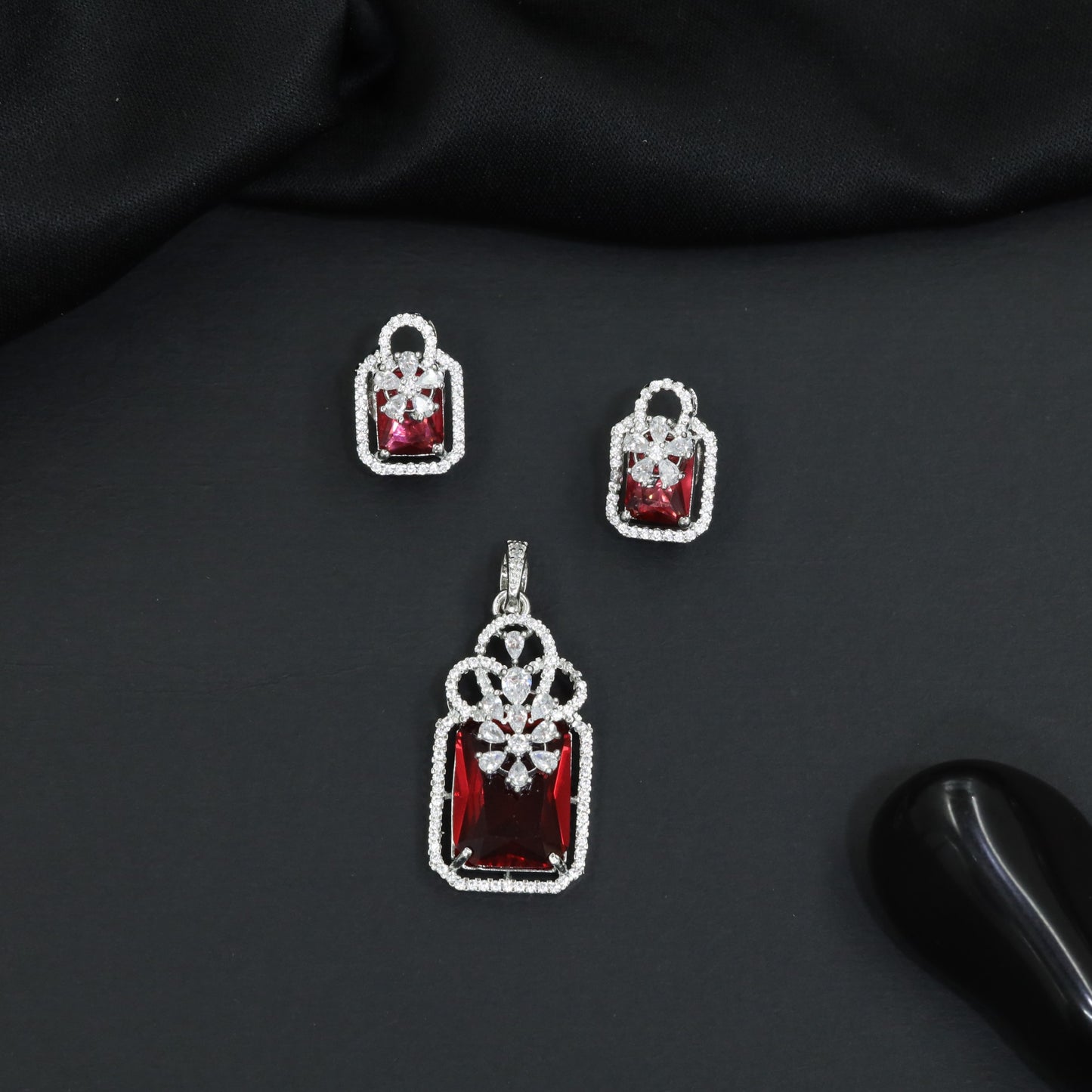 Open-frame pendant set with blossom centerpiece and matching studs