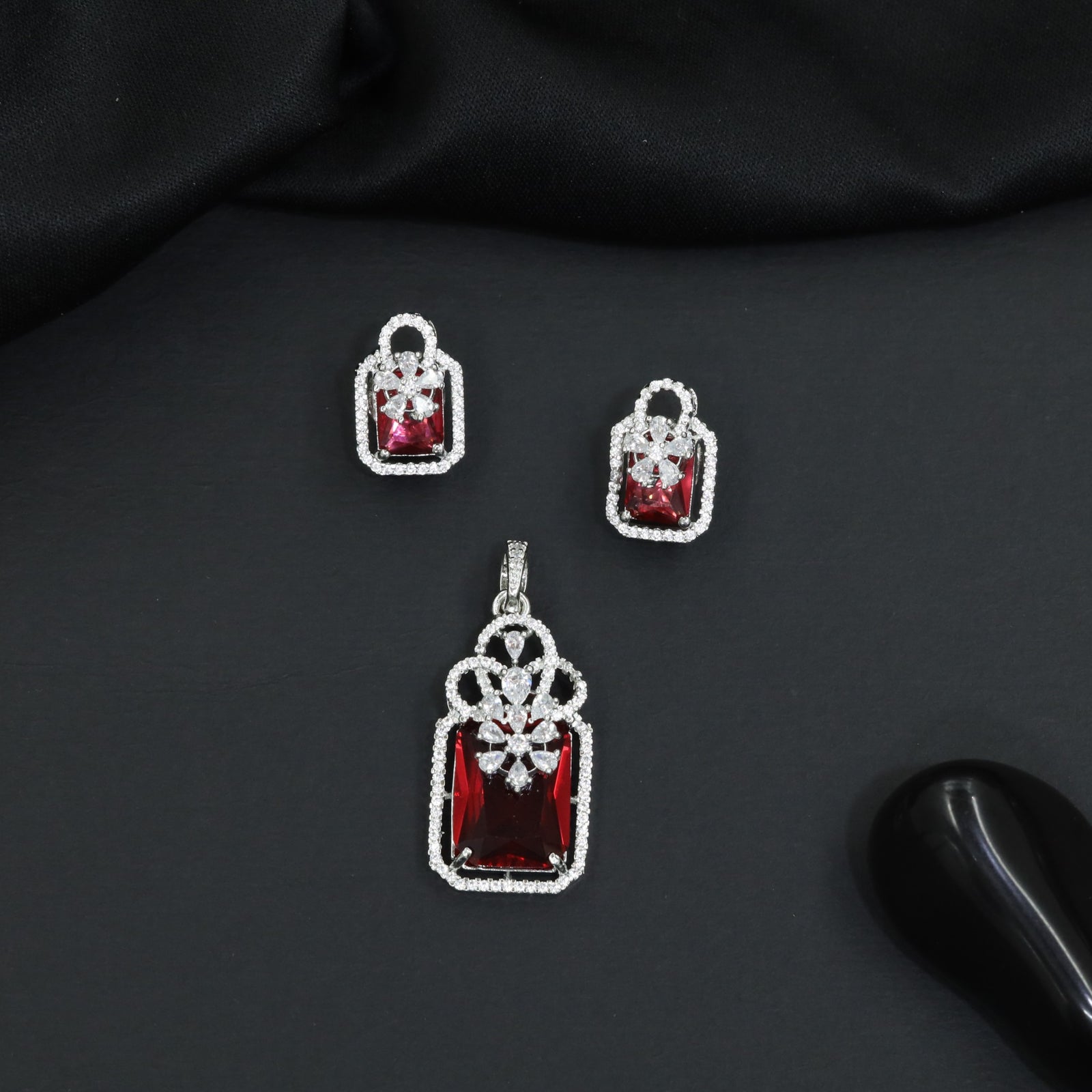 Open-frame pendant set with blossom centerpiece and matching studs