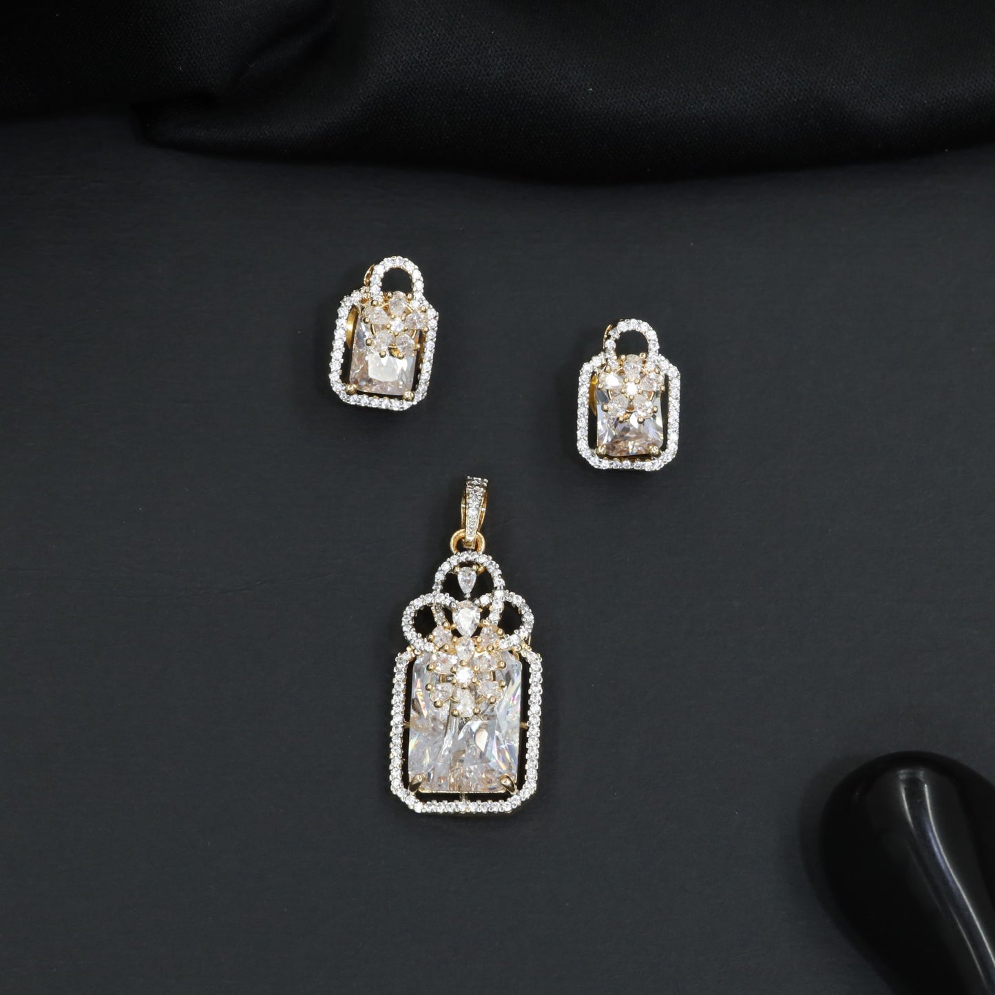 Open-frame pendant set with blossom centerpiece and matching studs