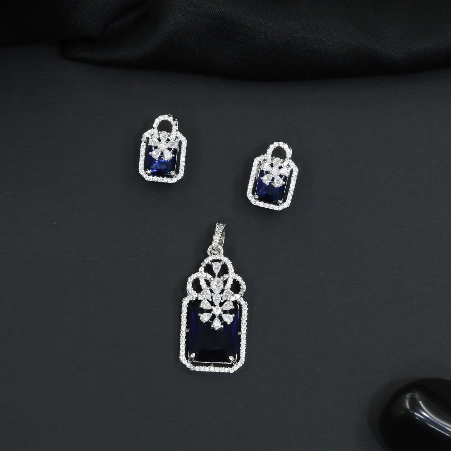 Open-frame pendant set with blossom centerpiece and matching studs