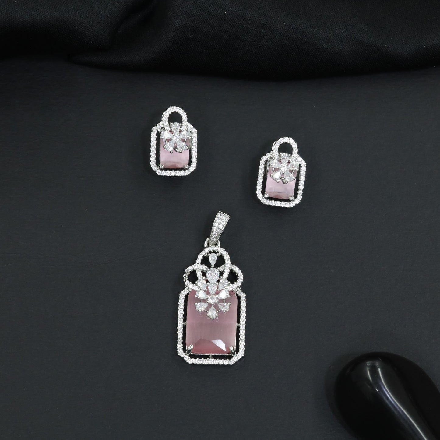 Open-frame pendant set with blossom centerpiece and matching studs