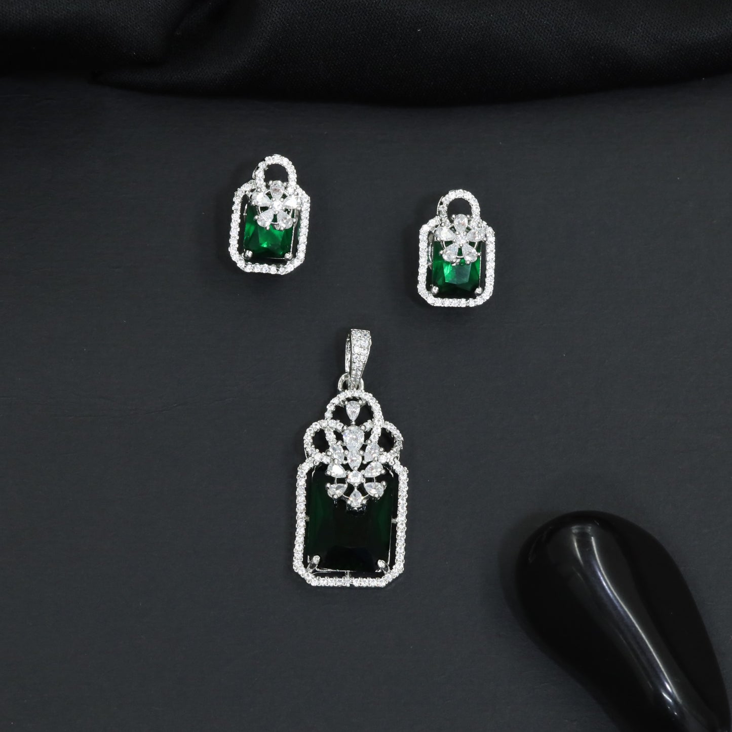 Open-frame pendant set with blossom centerpiece and matching studs