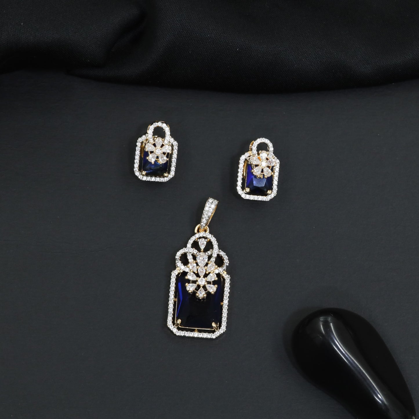 Open-frame pendant set with blossom centerpiece and matching studs