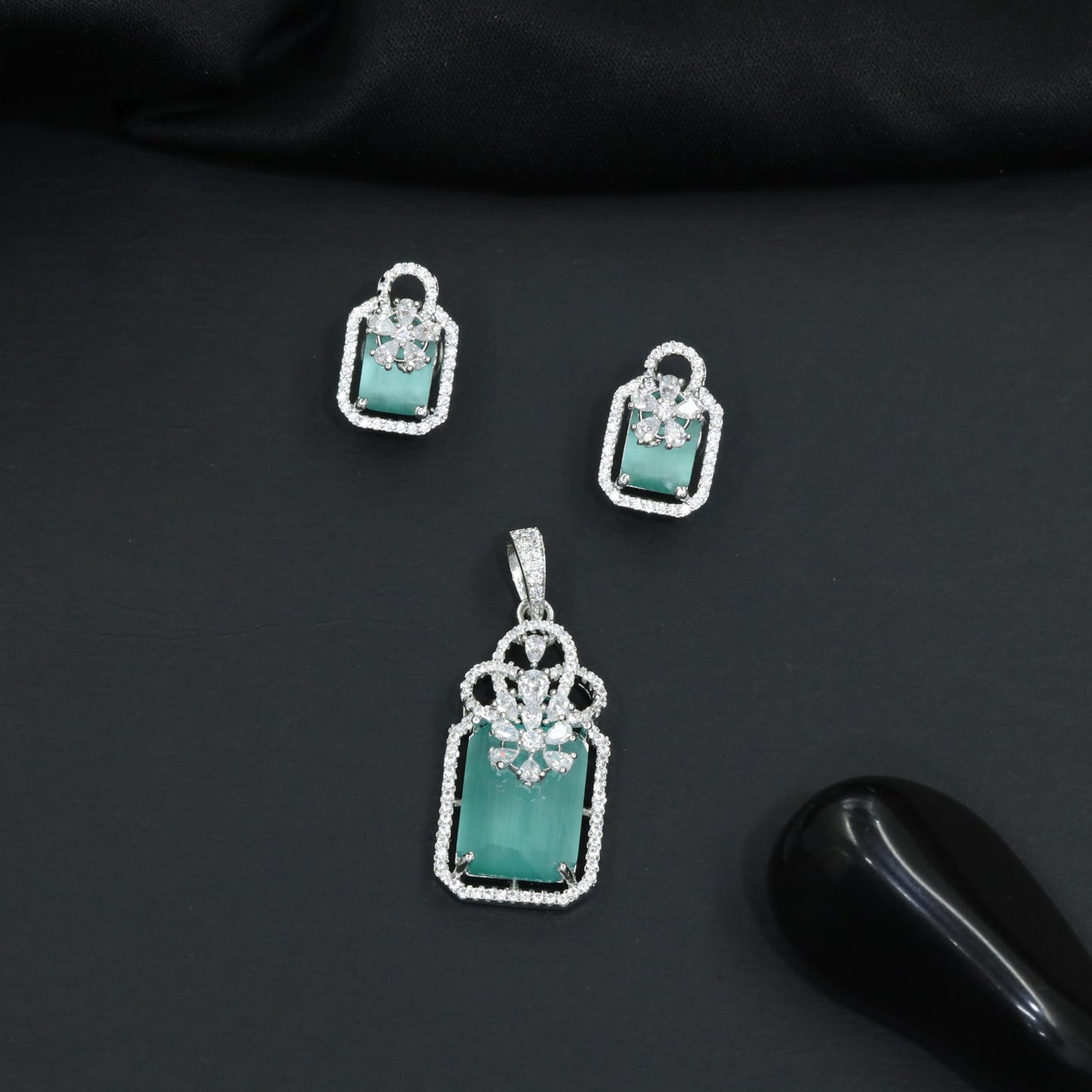 Open-frame pendant set with blossom centerpiece and matching studs